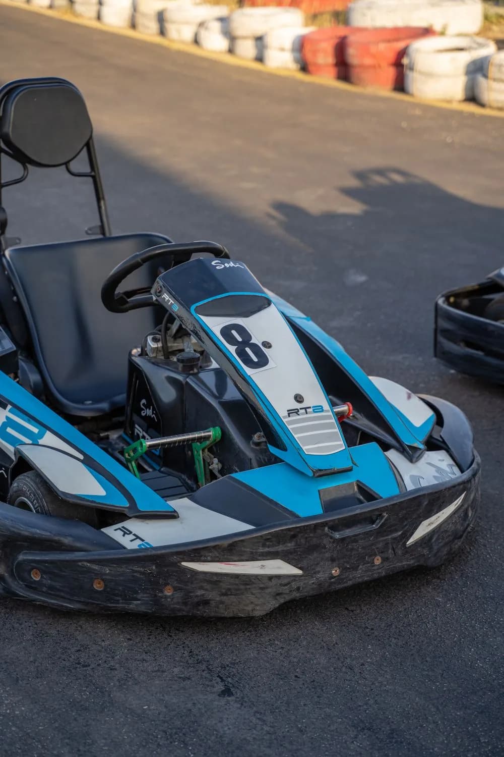 Junior racing kart parked on the Raceland track at sunset